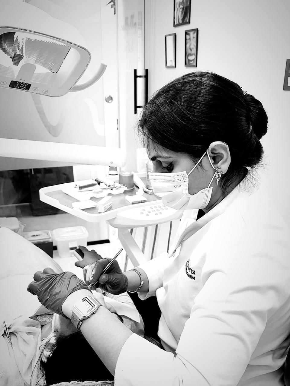 Dr. Mansi Dahiya Malik preparing instruments at the chair